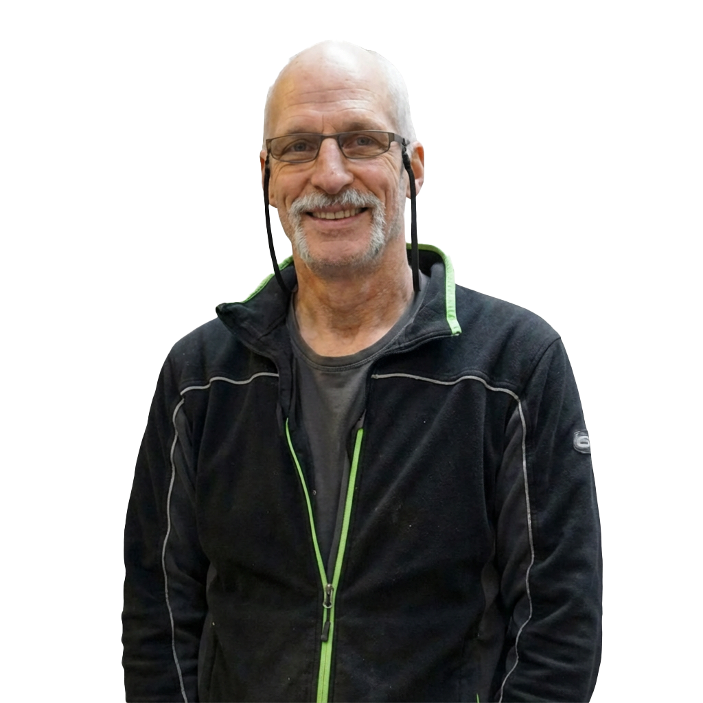 Porträtfoto von Jürgen Weil mit verschränkten Armen